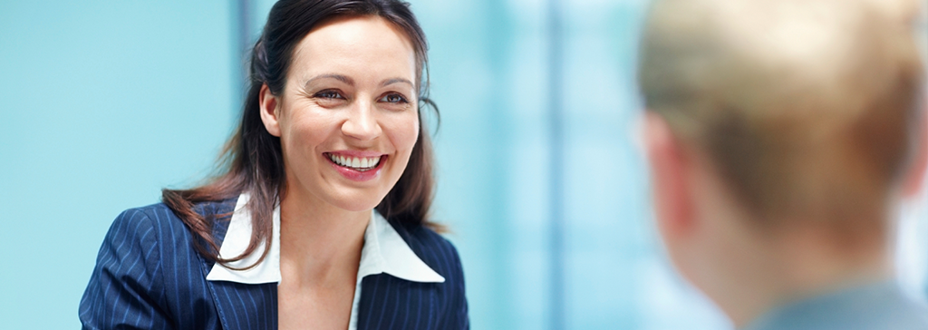 women-in-business-suit-holding-paper-1024x364